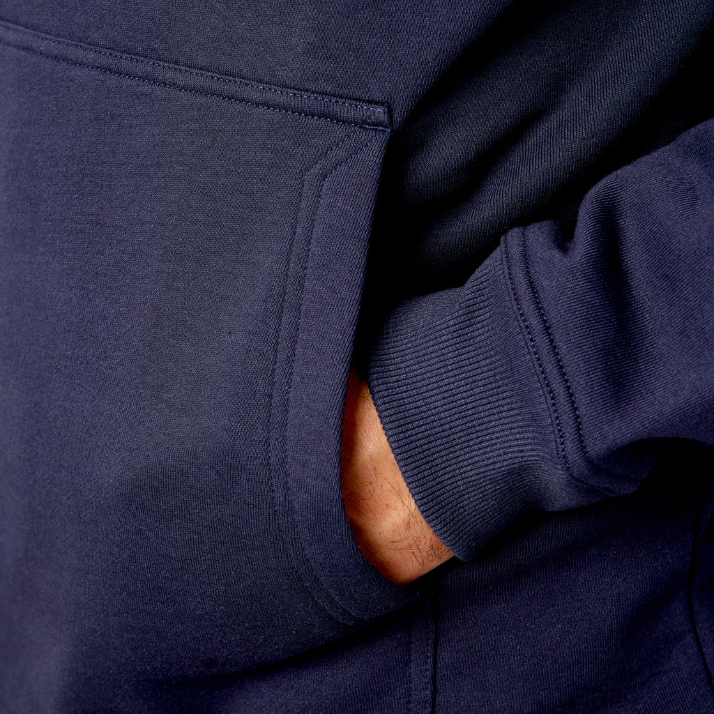 Front of hand pocket of the limited edition BRUNT water resistant shevlin work hoodie in navy with BRUNT on chest * 1