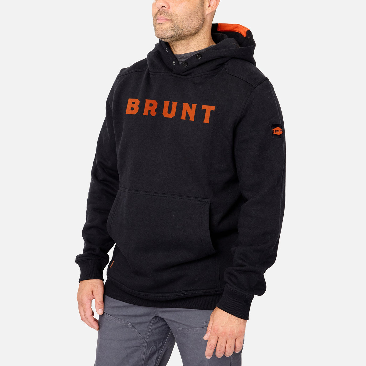 45 degree angle of the front left side of the limited edition BRUNT water resistant shevlin work hoodie in black with BRUNT on chest * 2