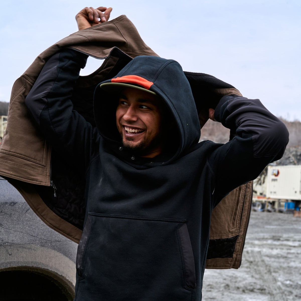 Man wearing BRUNT water resistant heavy duty shevlin work hoodie in black