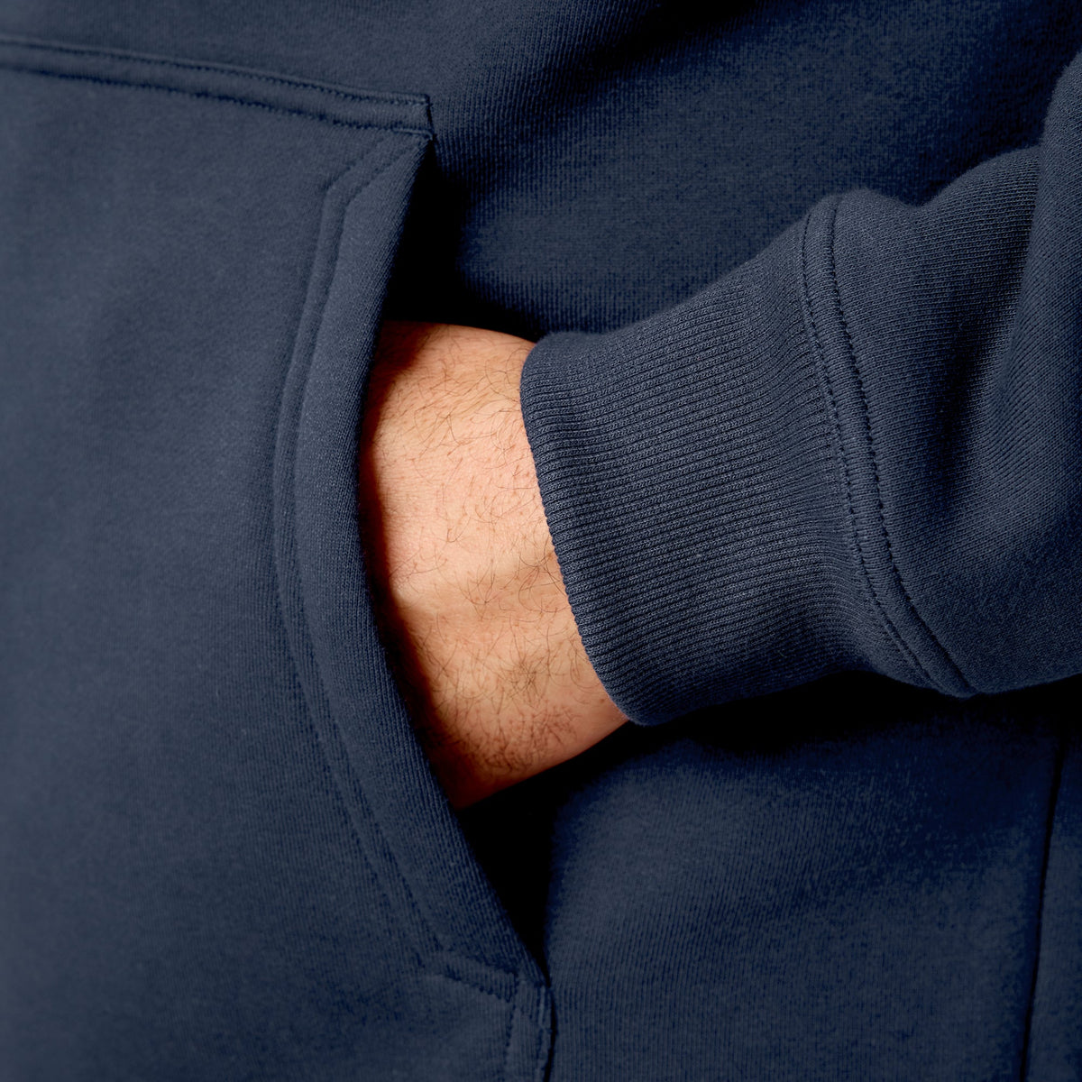 Front of hand pocket of the BRUNT water resistant shevlin work quarter zip hoodie in navy blue