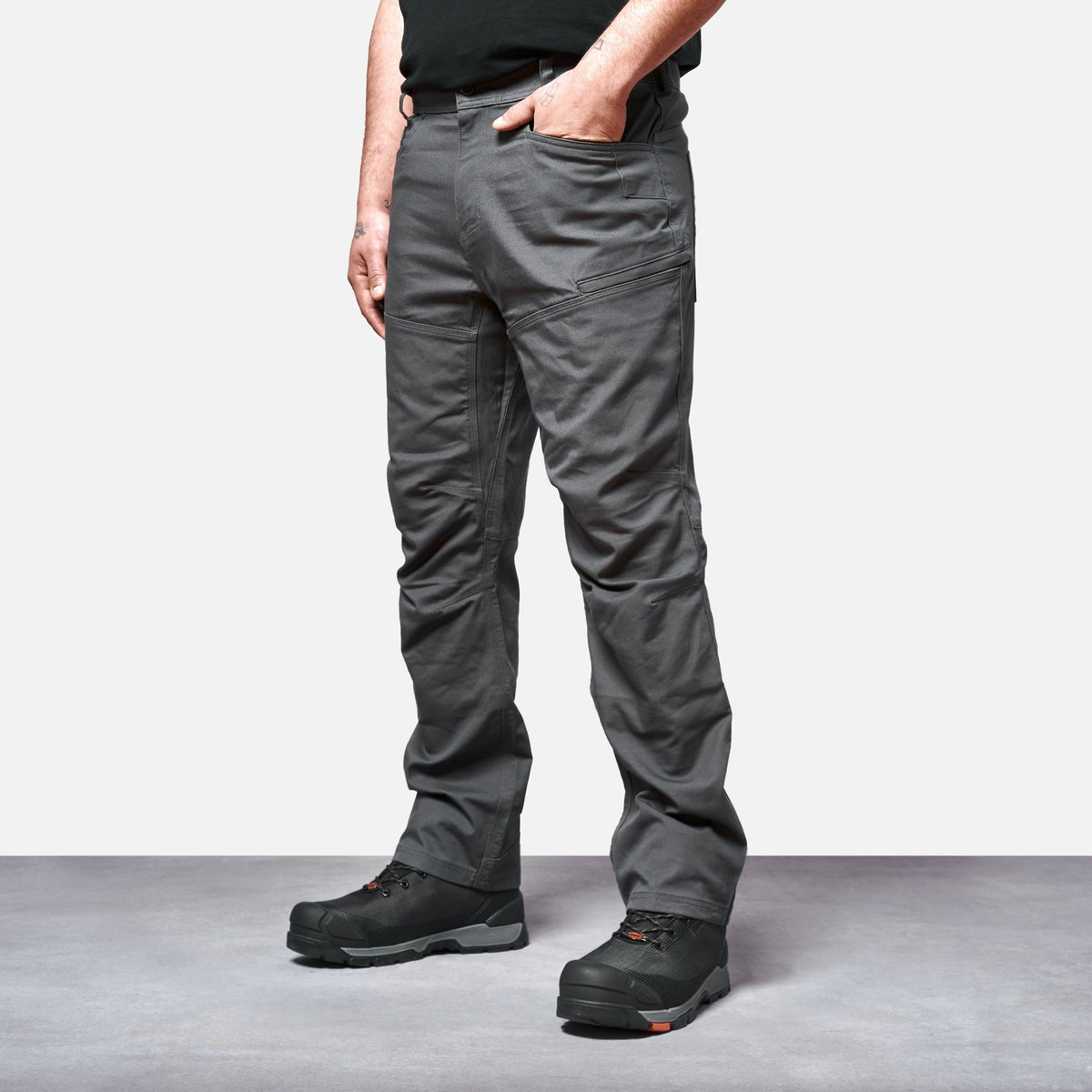45 degree angle of the front left side of the BRUNT water resistant double knee cargo pants in charcoal