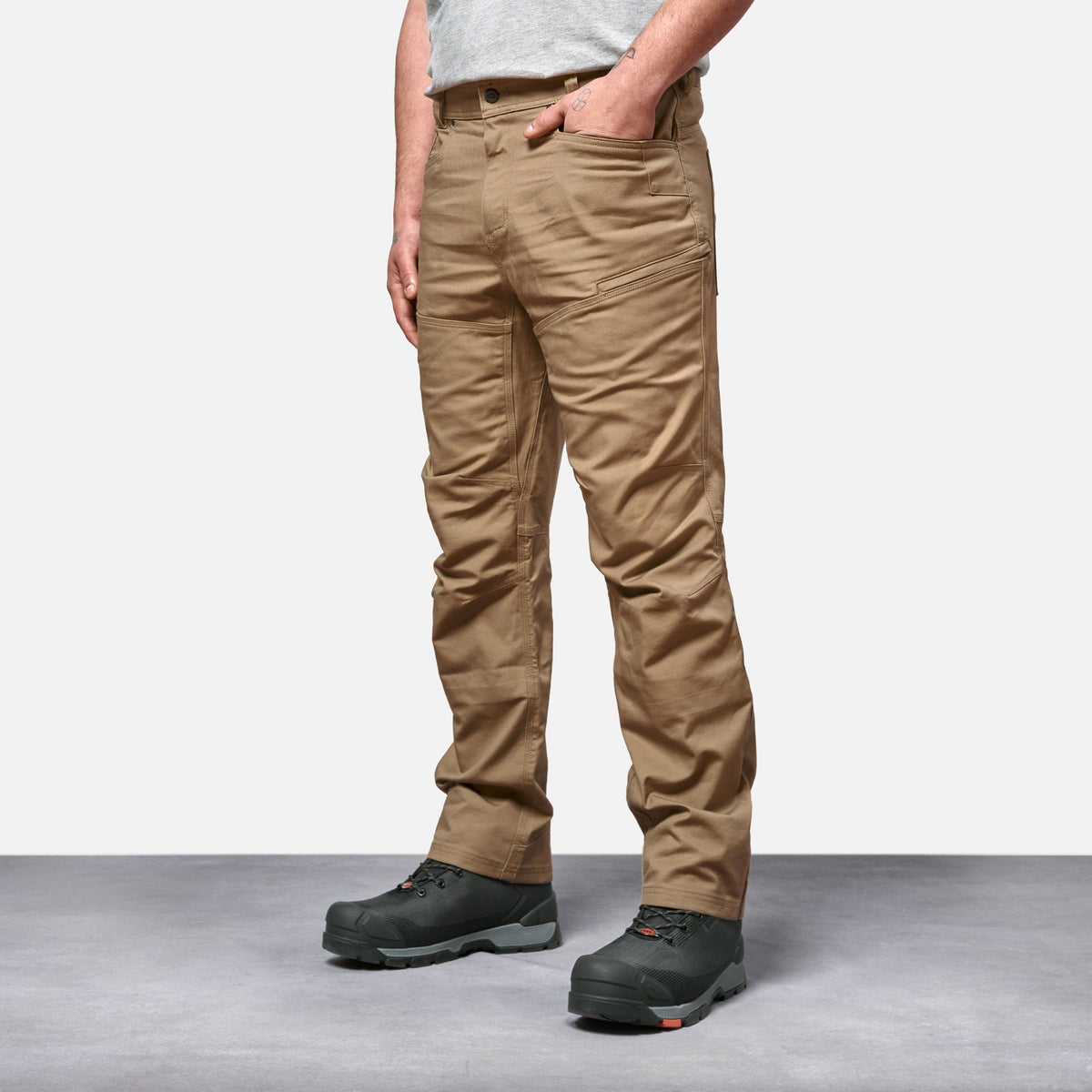 45 degree angle of front left side of BRUNT water resistant double knee cargo pants in tan