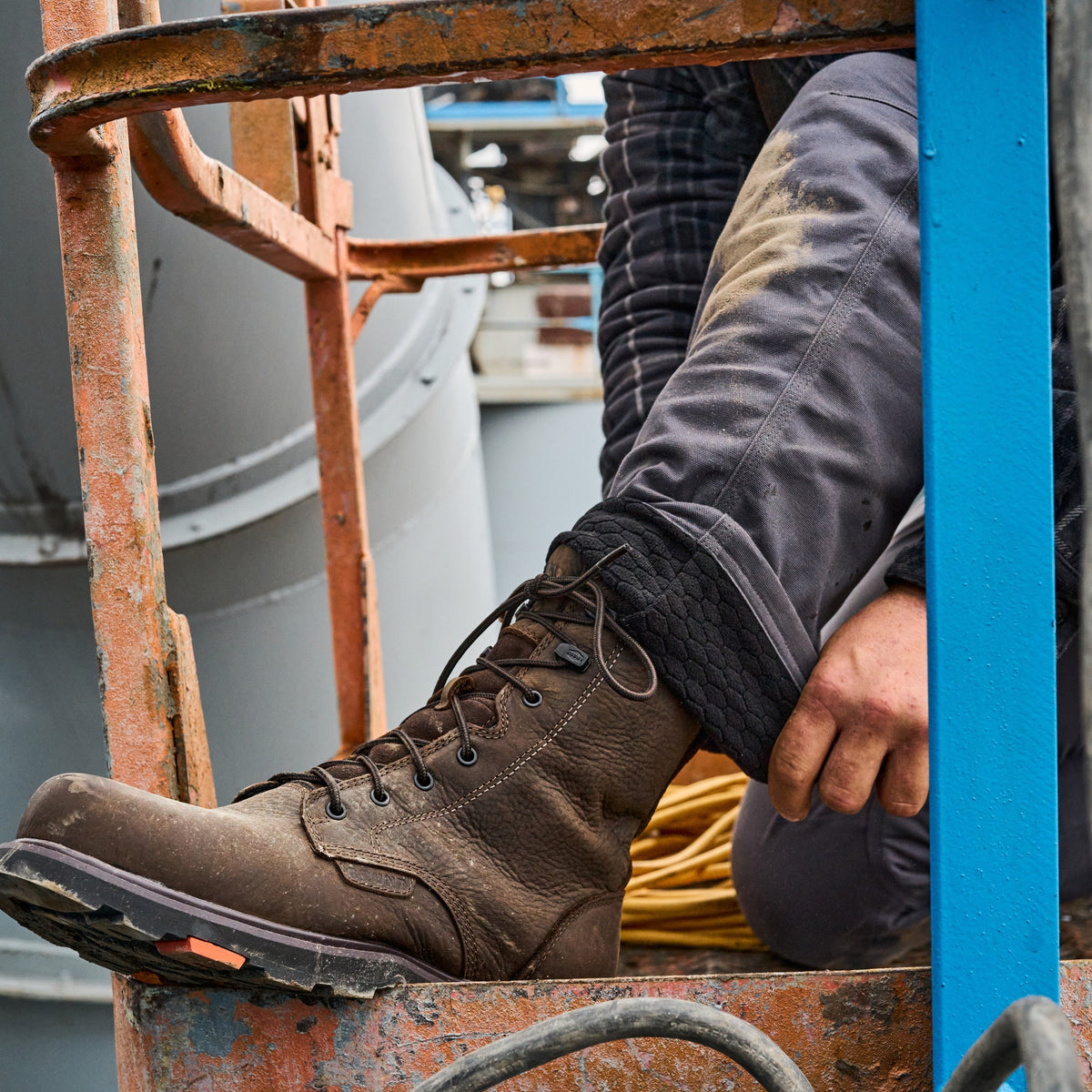 Man showing inslide lining of the BRUNT water resistant lined torra work pant in charcoal